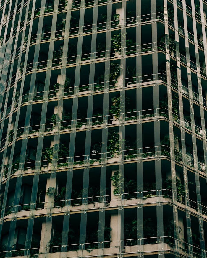 Crafting Captivating Headlines: Your awesome post title goes here A contemporary office building in Singapore featuring a green facade with vertical gardens.